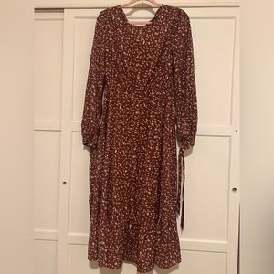 Brown long dress, with long sleeves.
